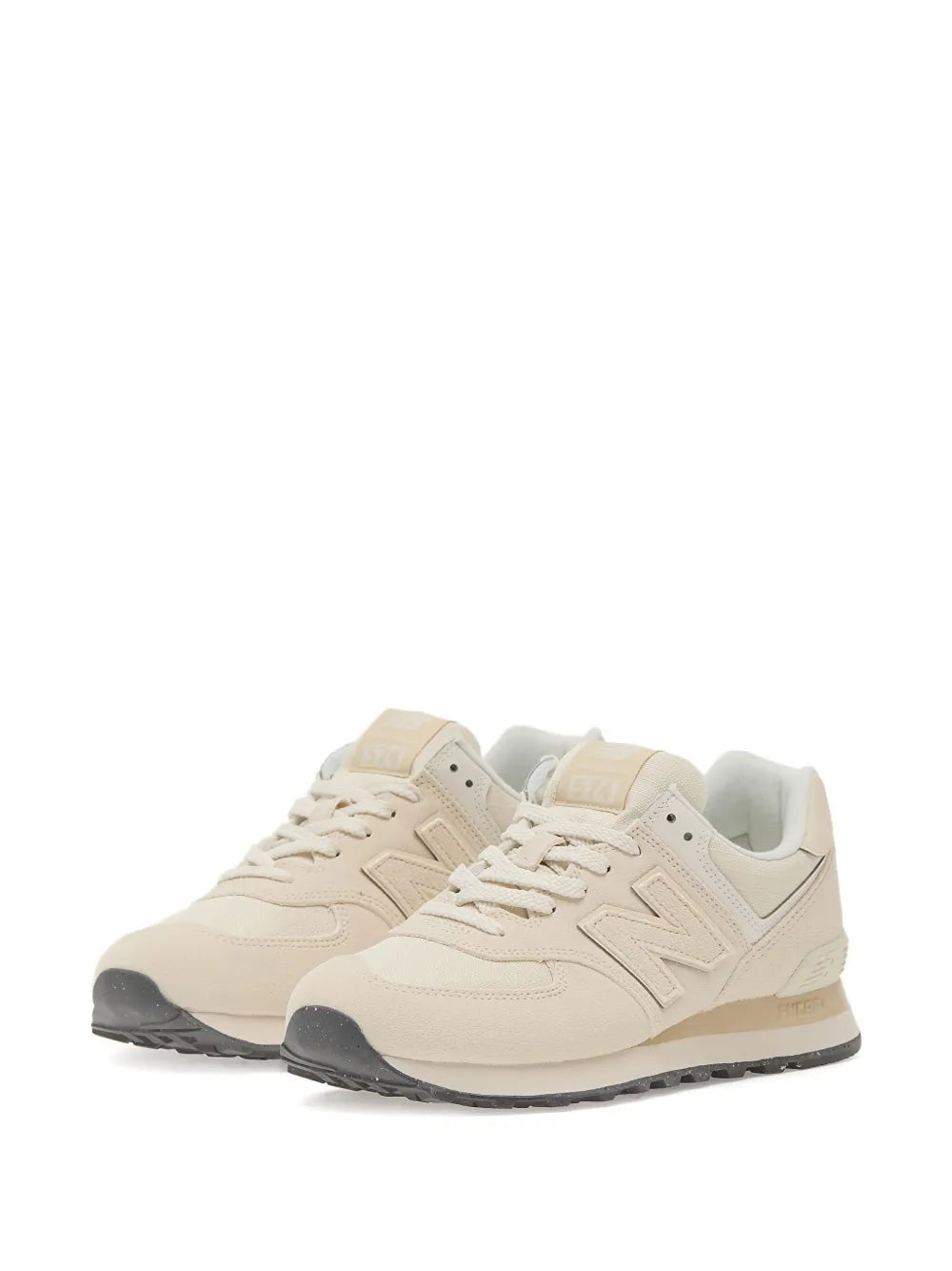 New Balance 574 beige lace-up sneaker with suede panels and textured rubber sole