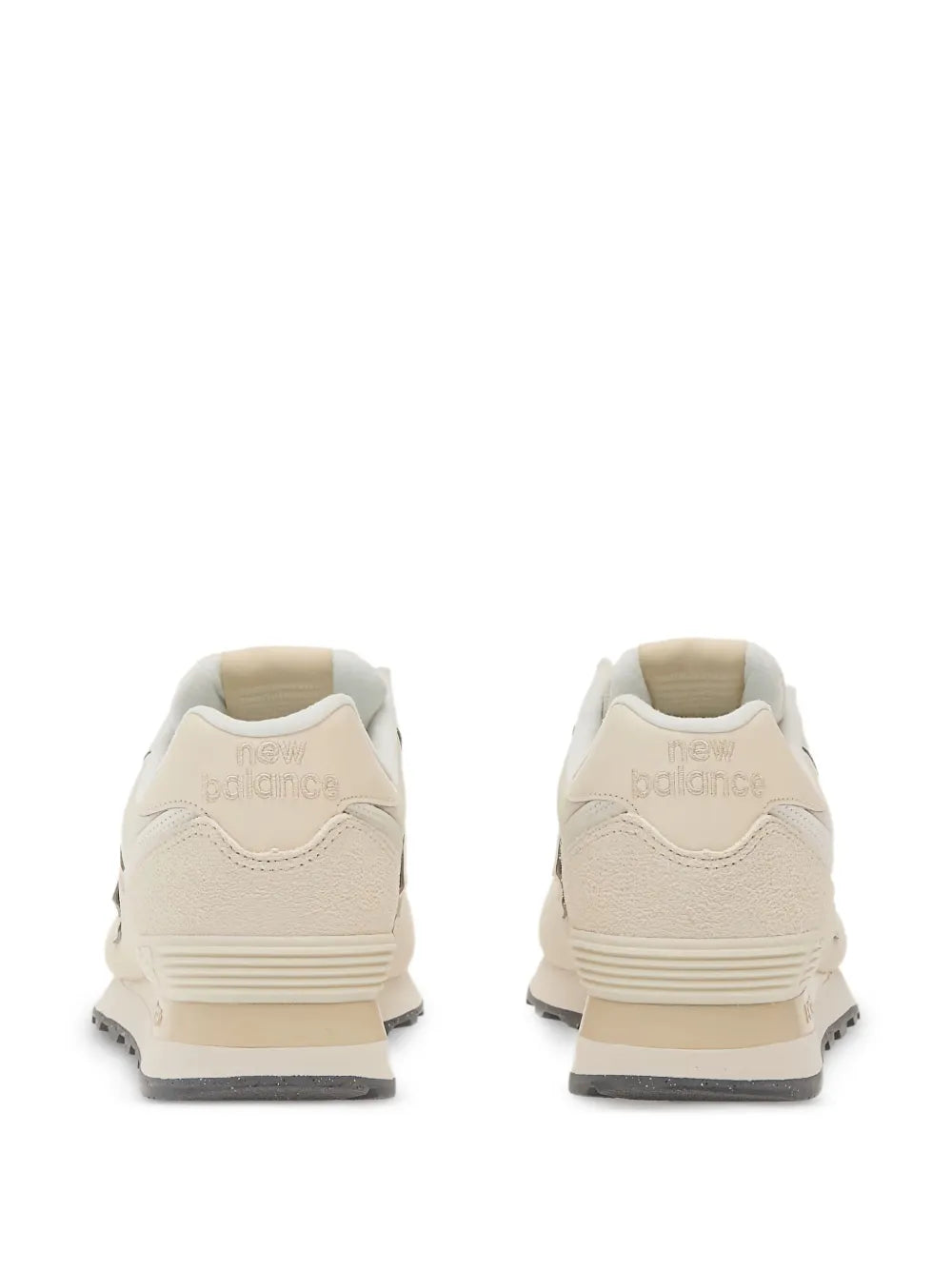 New Balance 574 beige sneakers with rear pull tab and cushioned heel