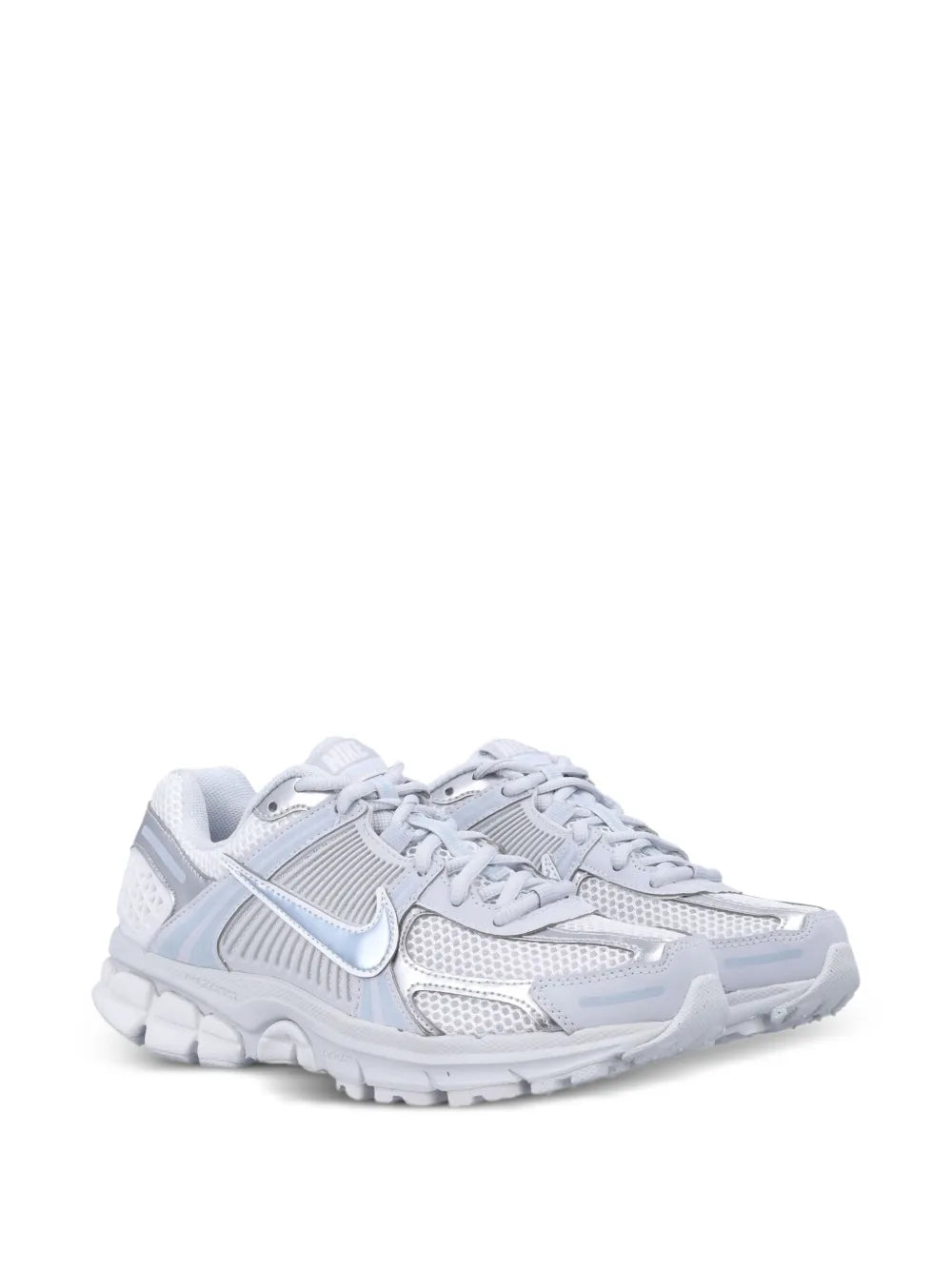 Nike Zoom Vomero 5 running shoe, side view, white mesh upper with blue accents