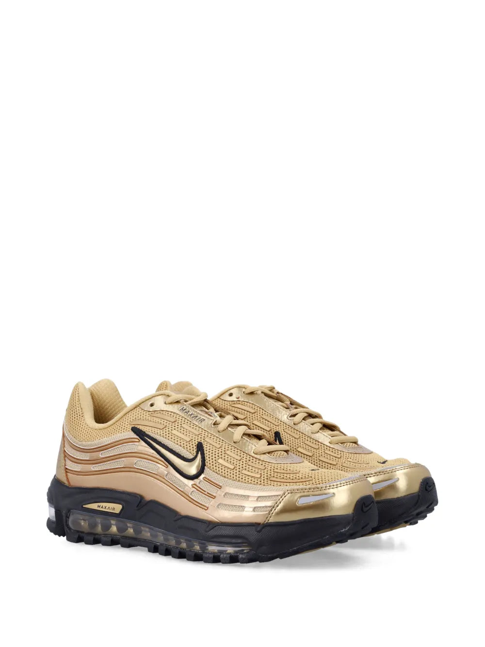 Beige running sneaker with Nike swoosh, visible Max Air heel bubbles and dark outsole