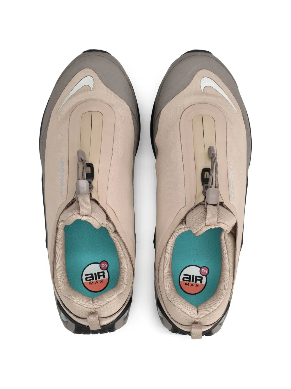 Beige Nike sneakers, toe view with air logo insoles and lace closure