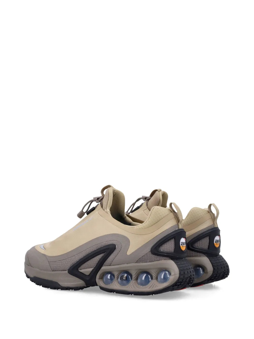 Beige Nike sneakers, back 3/4 view with pull tabs and air-cushion sole