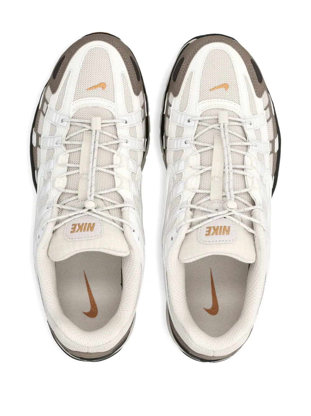 Pair of white lace-up trainers with Nike swoosh and brown heel panels, grey trim
