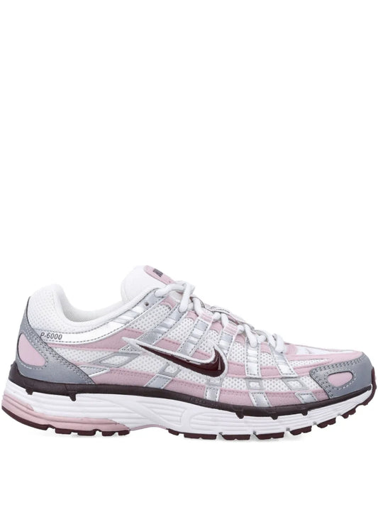 Nike white panelled trainers with silver and pink accents, lace-up