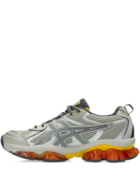 Grey running shoes with orange and yellow GEL cushioning pods