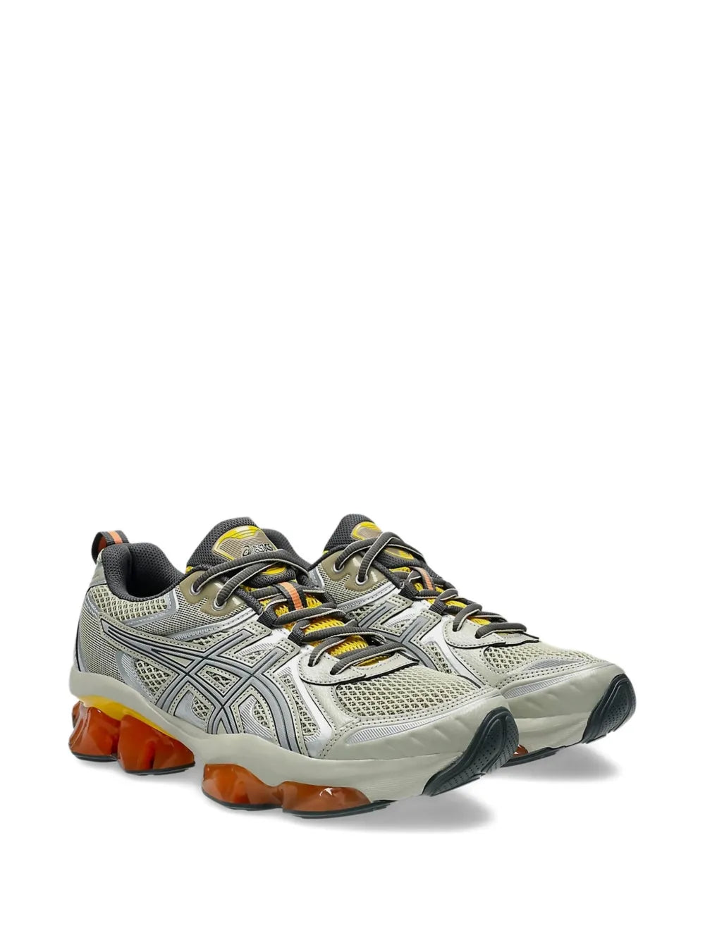 Light grey running shoes with black laces and orange GEL pods