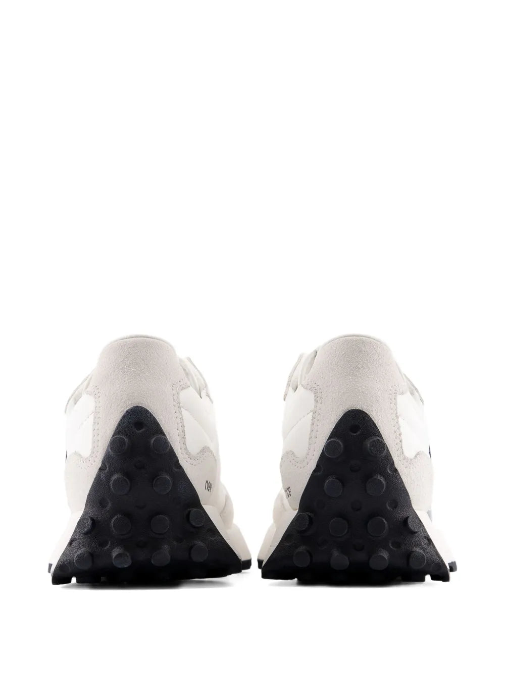 Low-top sneaker heel view, white upper with dark heel panels and black tread