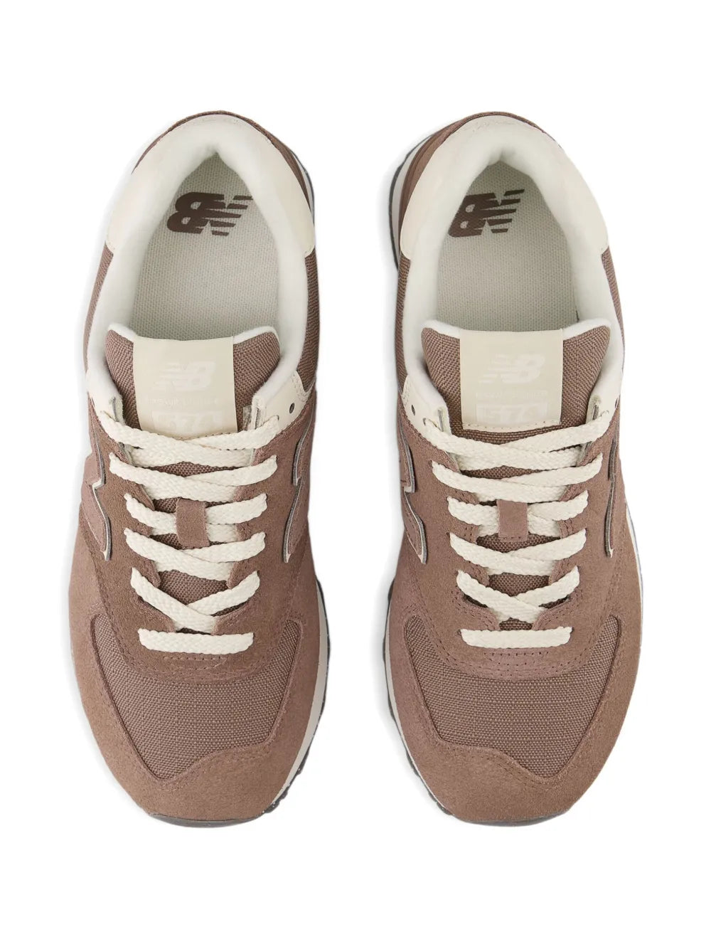 Brown New Balance 574 sneakers with white laces and cream interior, front view