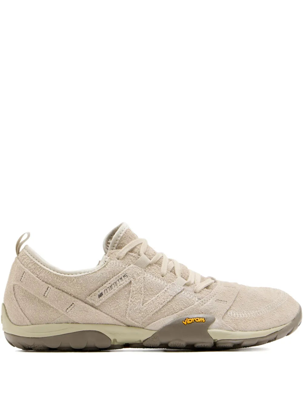 Beige New Balance suede lace-up running shoe with cushioned rubber sole