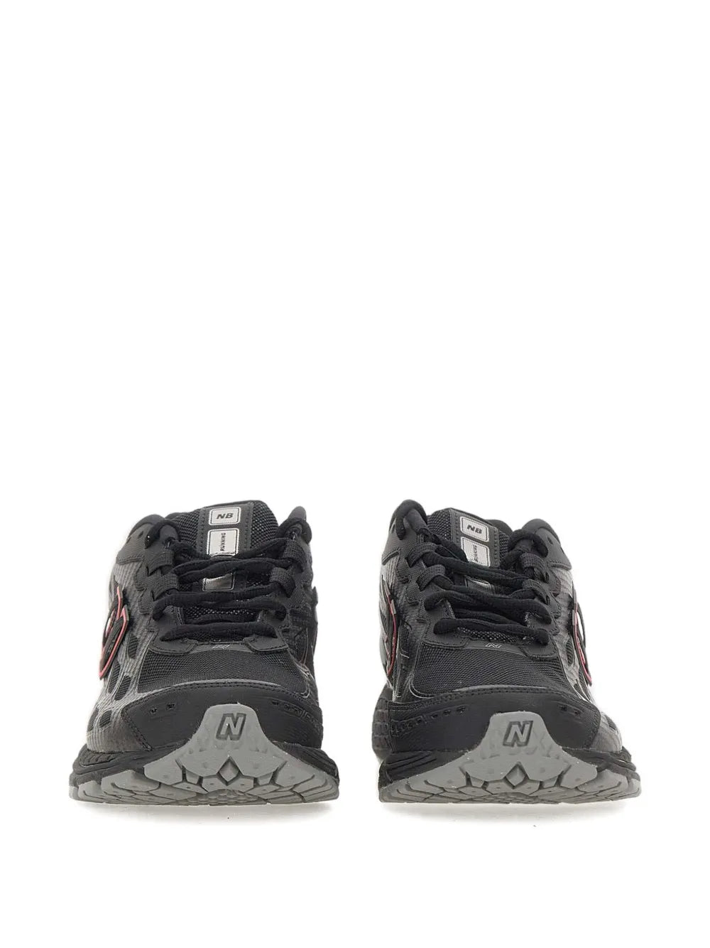 Black mesh sneakers with NB logos, black laces, and gray textured toe caps