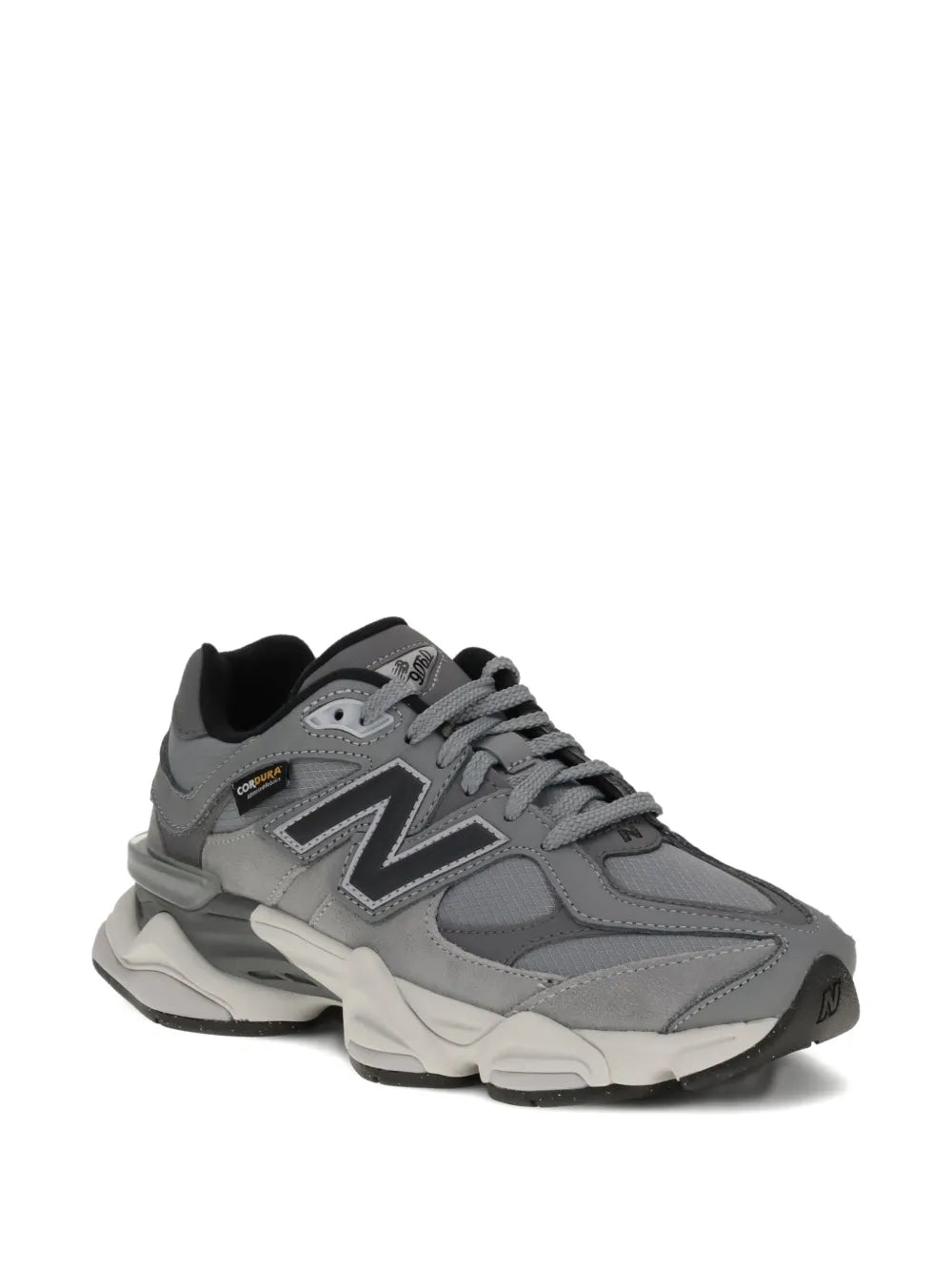 Grey running sneaker with side N logo, chunky sole, and lace-up upper