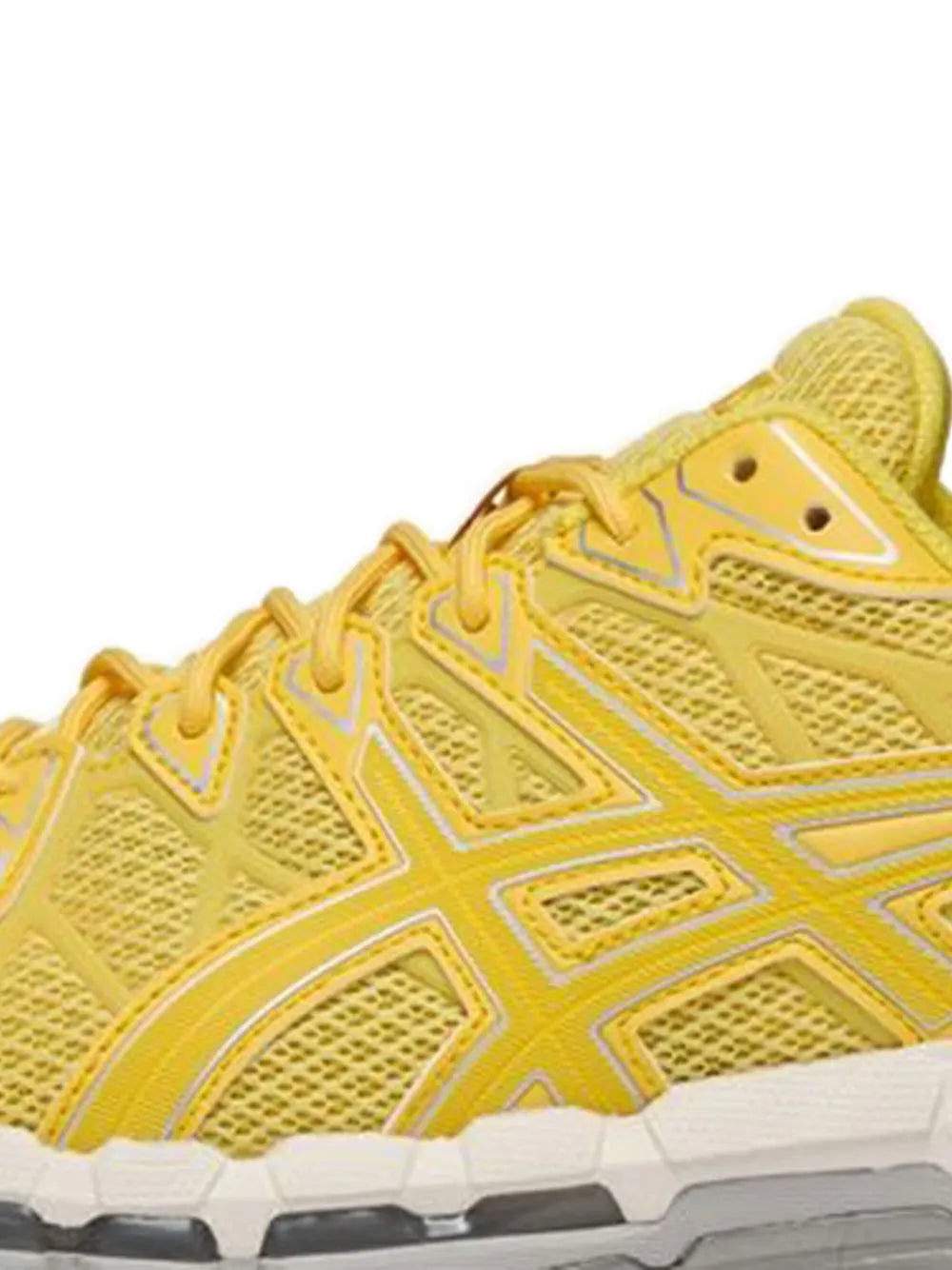 Yellow mesh sneaker upper with lace eyelets and geometric stripe panel detail