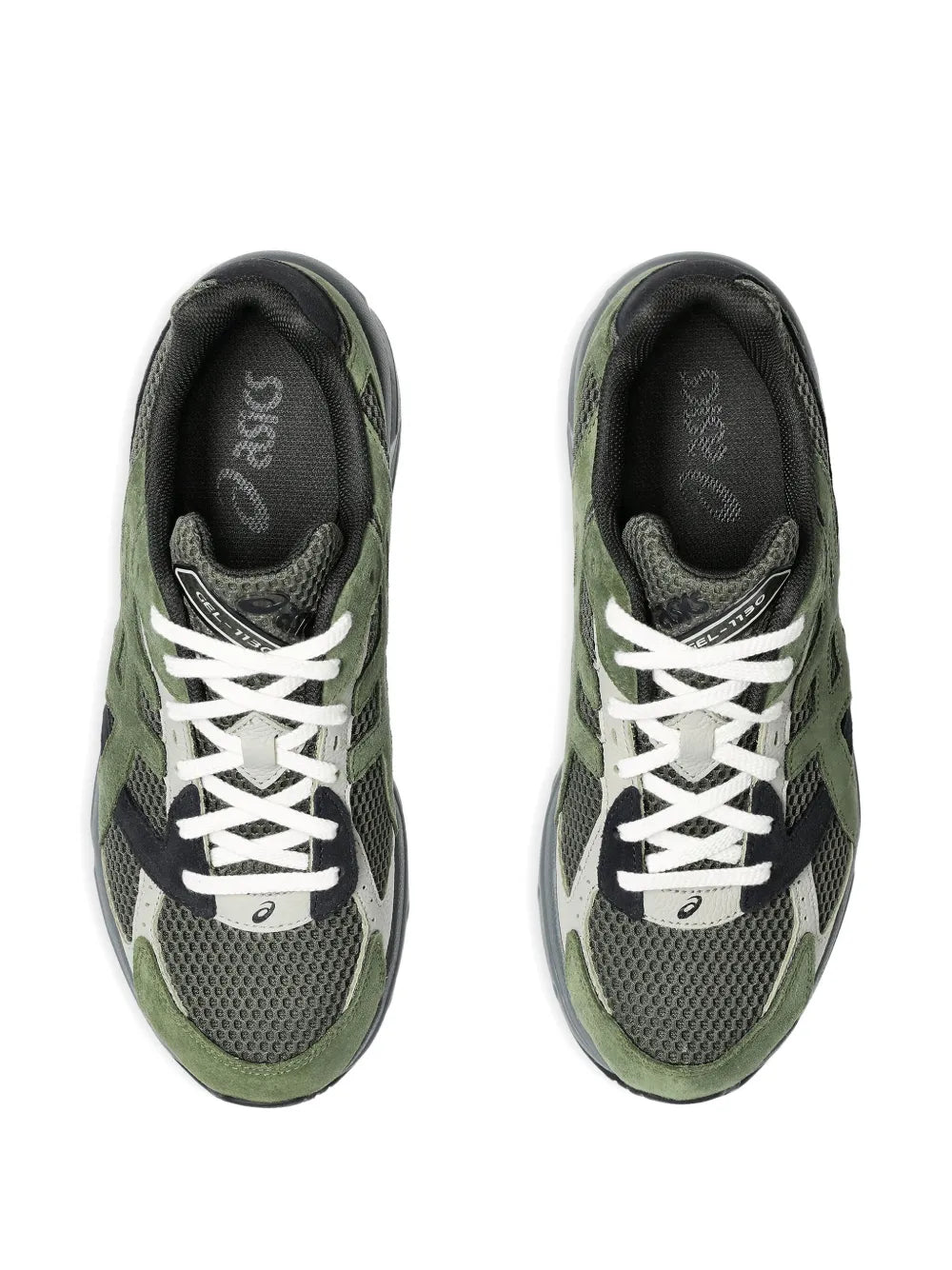 Green and black sneakers with white laces, tongue and lace detail