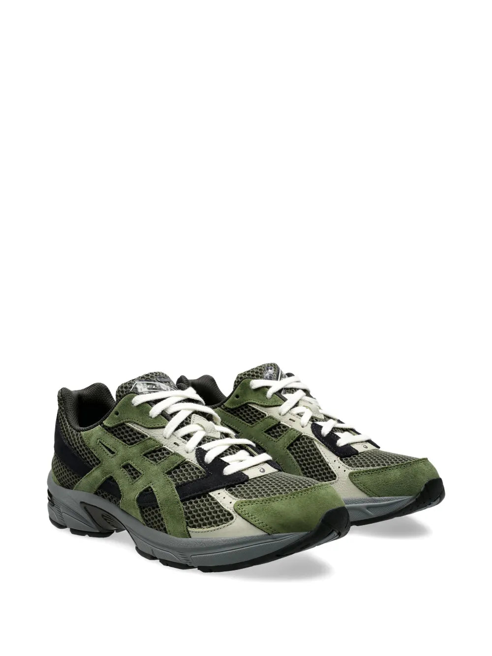 Green and black running shoes with white laces, side view