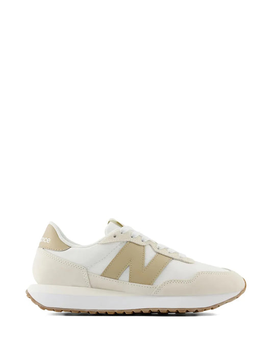 New Balance 237 lace-up sneakers in white with beige logo and gum rubber sole