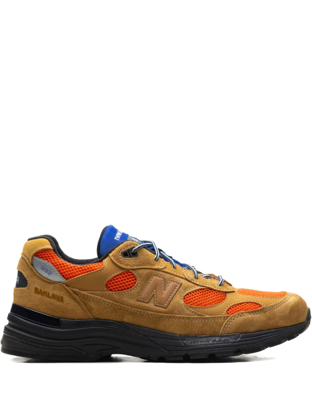 Tan suede New Balance 992 sneakers with orange and blue accents, black rubber sole