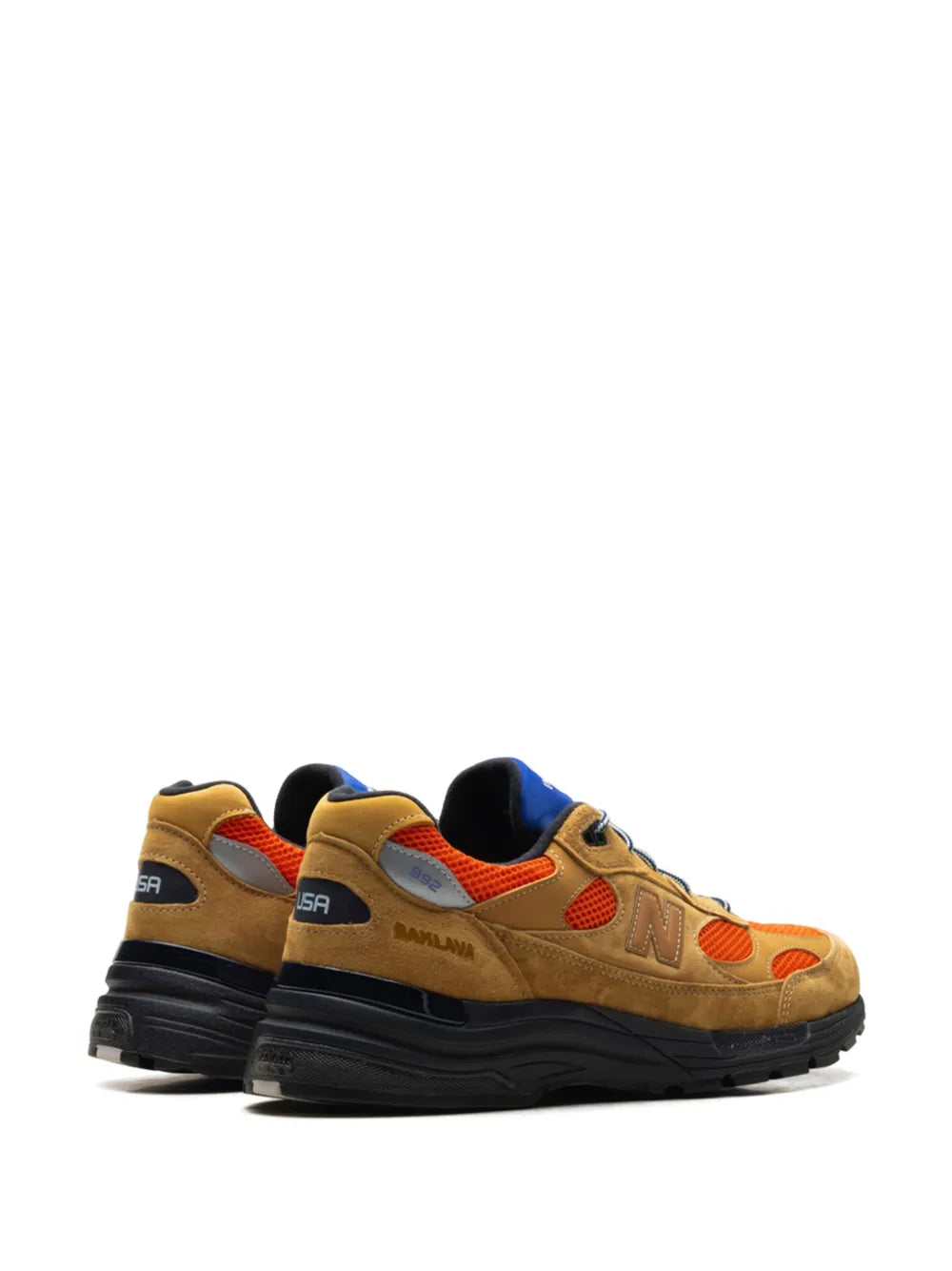 Tan suede New Balance 992 sneakers with heel branding, orange accents, blue collar, black sole