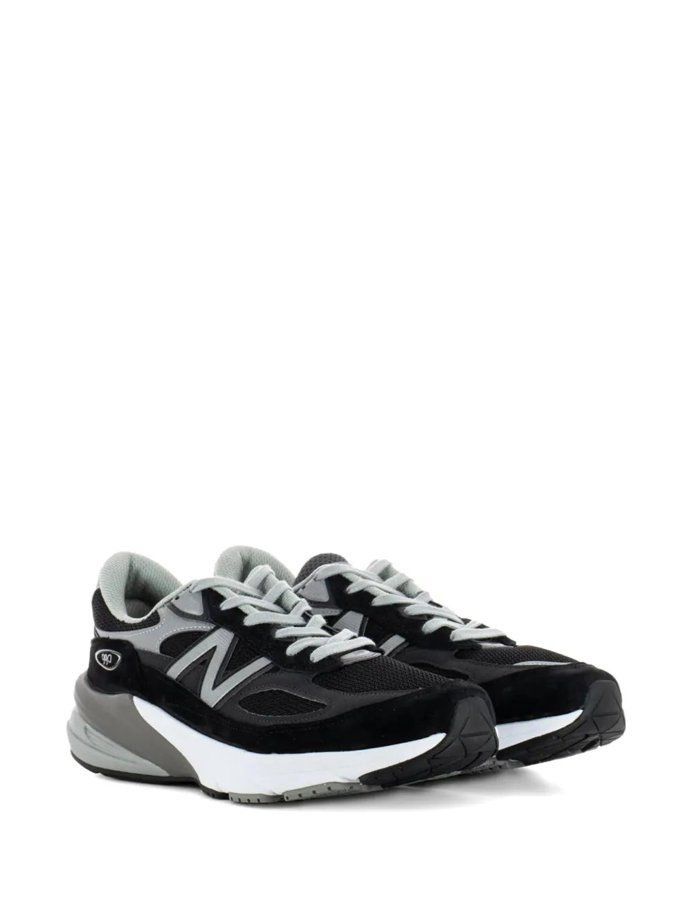 Black New Balance 990V6 lace-up sneaker with white N logo and white/gray sole
