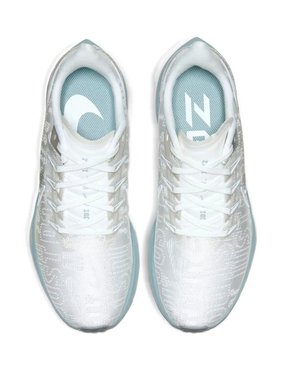 White Nike running sneakers with mesh upper and light-blue inner lining.