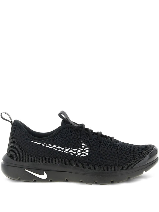 Black knit running sneaker with white Swoosh logo and lace-up closure