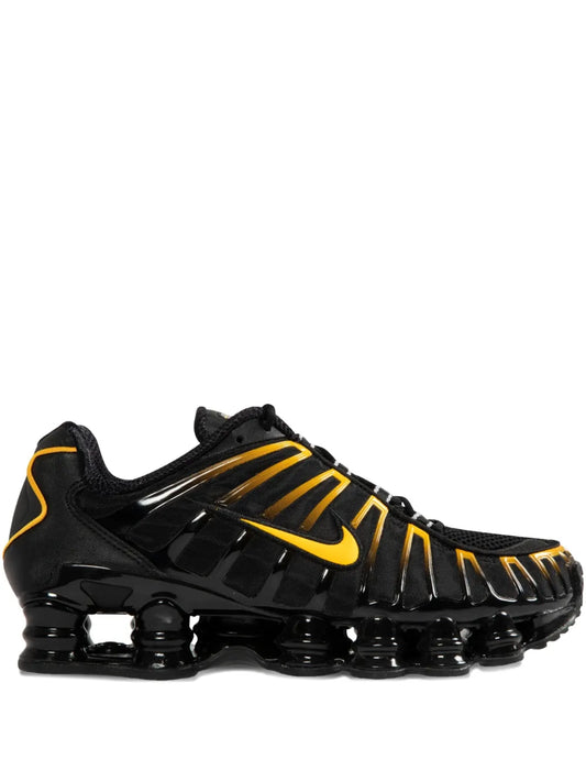 Nike Shox Tl running shoes in black with yellow swoosh and laces
