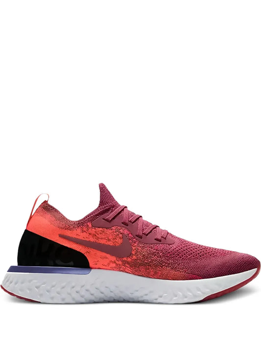 Red Nike React Flyknit running shoe with knit upper and white midsole