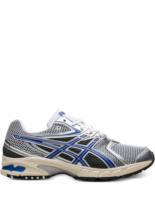 White low-top running sneaker with blue accents and mesh upper