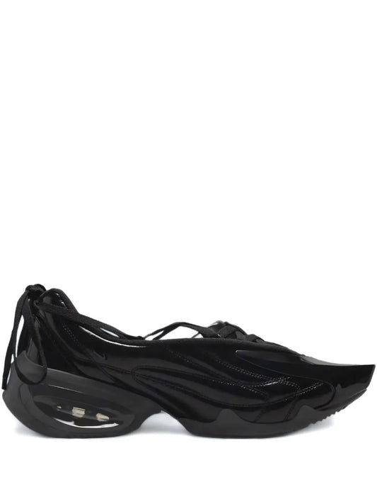 Black lace-up sneaker with layered panels and swoosh detail