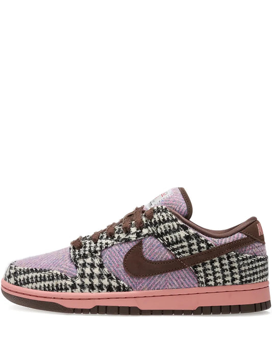 Purple tweed Dunk Low sneakers with brown laces, dark swoosh, and cushioned sole.
