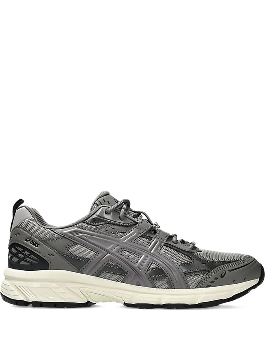 Grey lace-up running shoe with mesh upper and cushioned white midsole