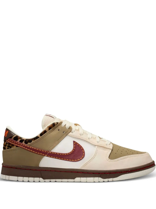 Nike low-top sneakers with beige, white panels and red-brown swoosh