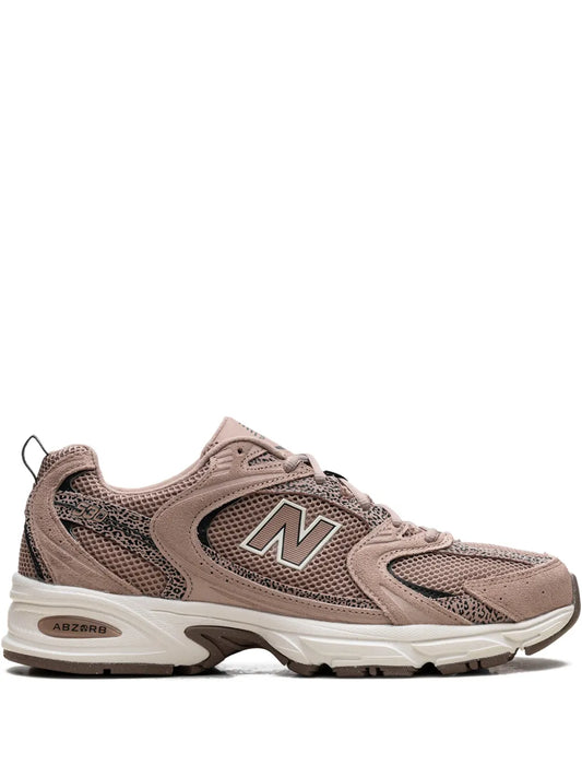Taupe lace-up running shoe with N logo on side and ABZORB detail