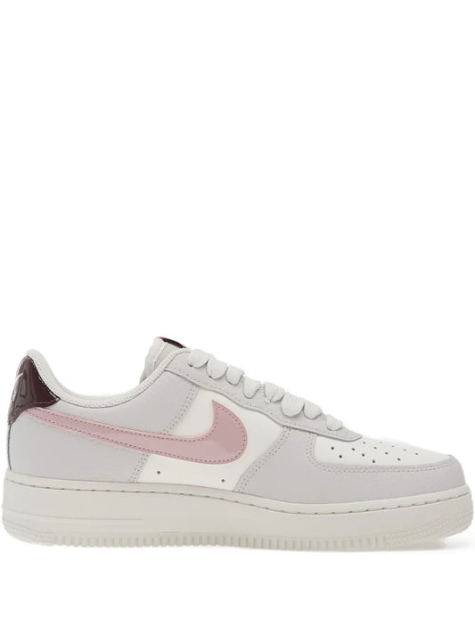 Nike Air Force 1 '07 low-top sneaker in white leather, pink swoosh, burgundy heel