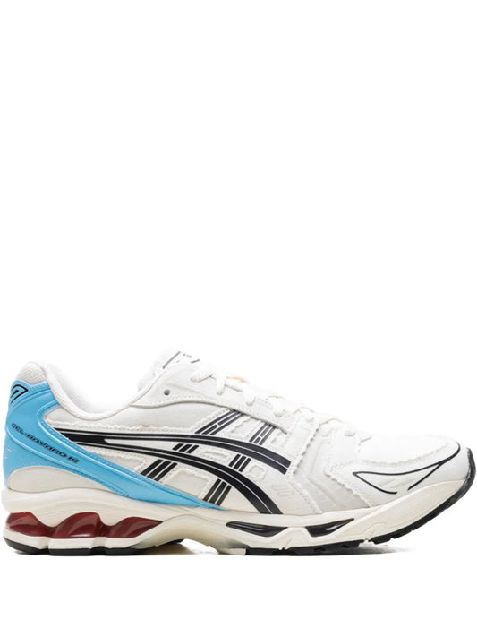 White and blue sneakers with black striped side panel and lace-up front