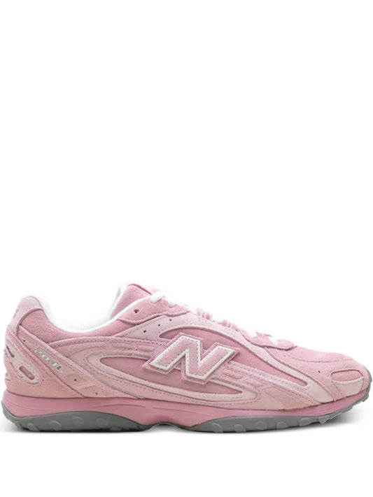 Pink New Balance 204L running shoes with N logo, lace-up front, cushioned sole