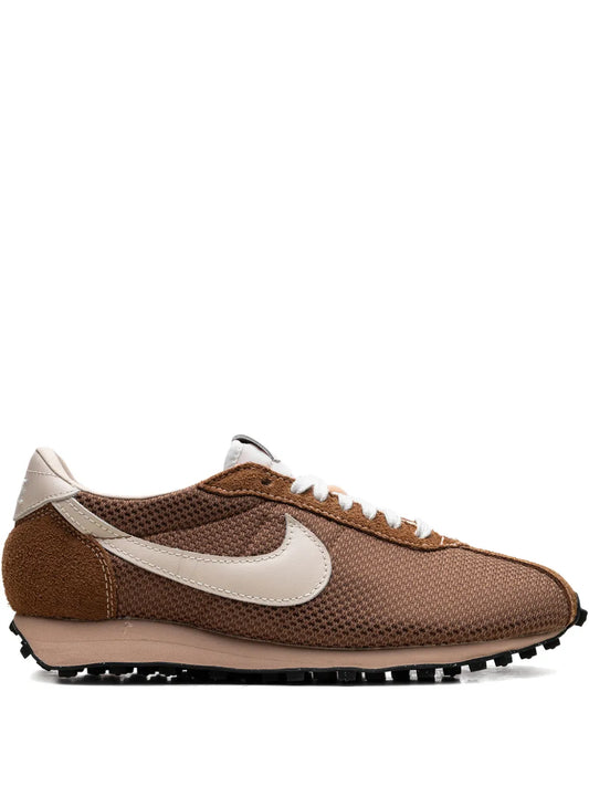 Brown Nike lace-up logo sneaker with white swoosh and mesh upper.
