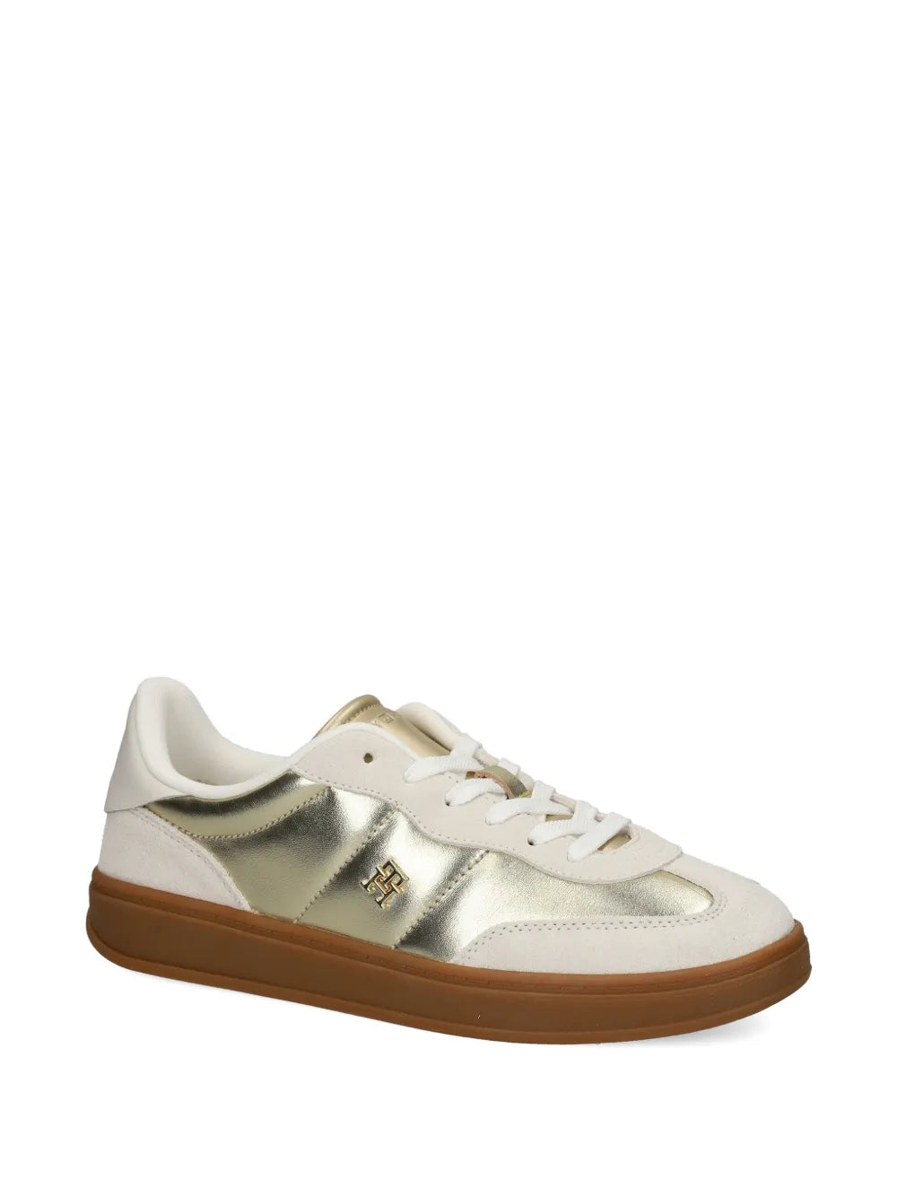 White and gold low-top sneakers, side view with gold logo plaque and lace-up front
