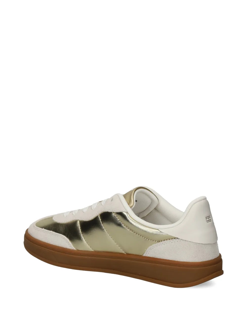 White and gold low-top sneakers, rear three-quarter view with gum rubber sole