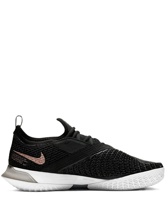 Nike black tennis shoe with knit upper, lace-up closure, bronze swoosh, white sole