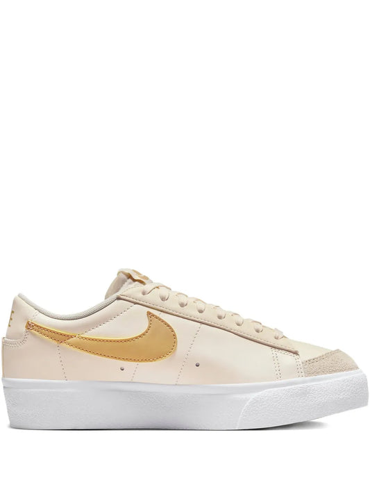 Nike Blazer Low ivory low-top sneaker with gold swoosh and white rubber sole