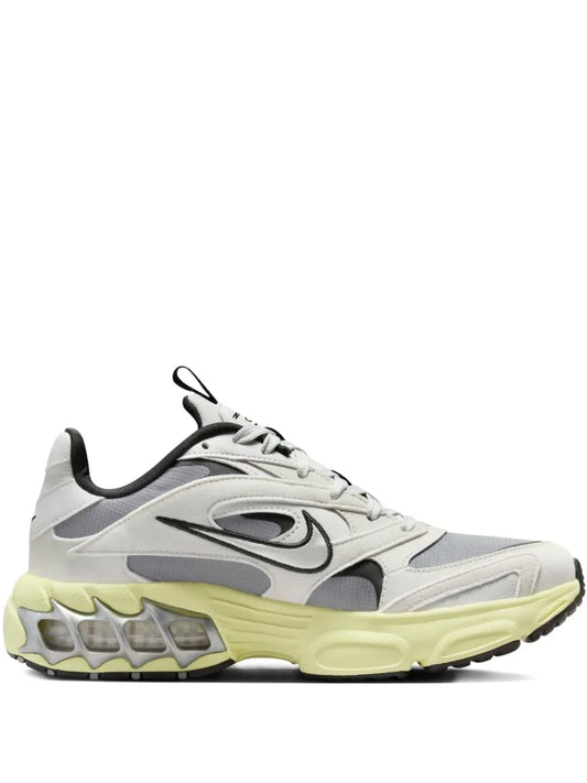 Nike grey lace-up running sneakers with black heel and lime yellow outsole