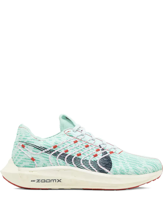 Nike Pegasus running shoes with mint knit upper, red accents, and ZoomX midsole