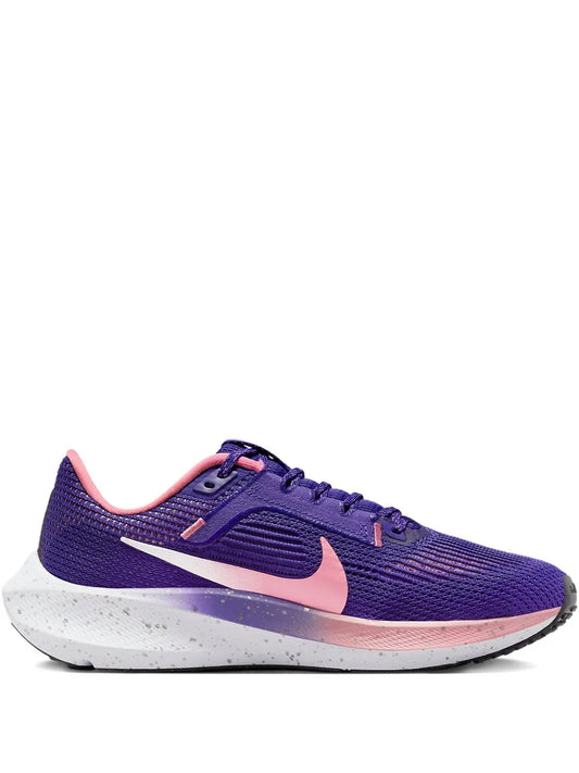 Nike purple lace-up running shoe with pink trim and white sole