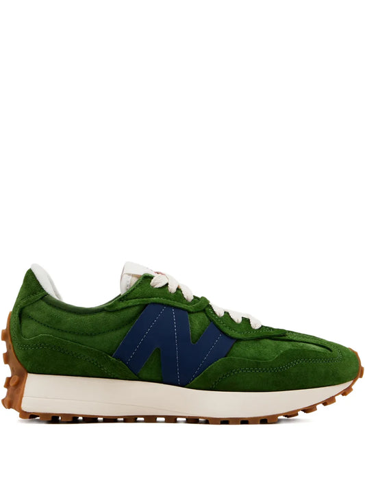 Green suede lace-up sneakers with navy paneling, white laces, and gum rubber sole.
