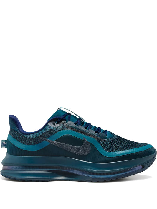 Nike blue mesh running shoe with gray swoosh and teal rubber sole