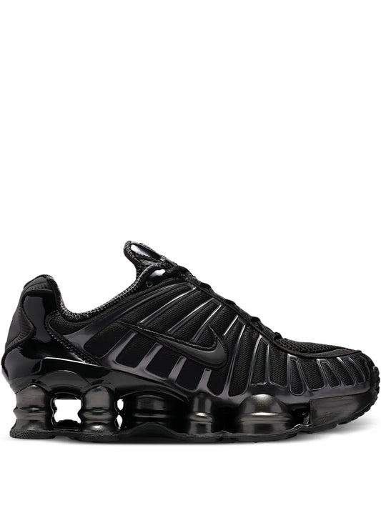 Nike Shox black lace-up sneaker with ribbed upper and glossy cushioning sole