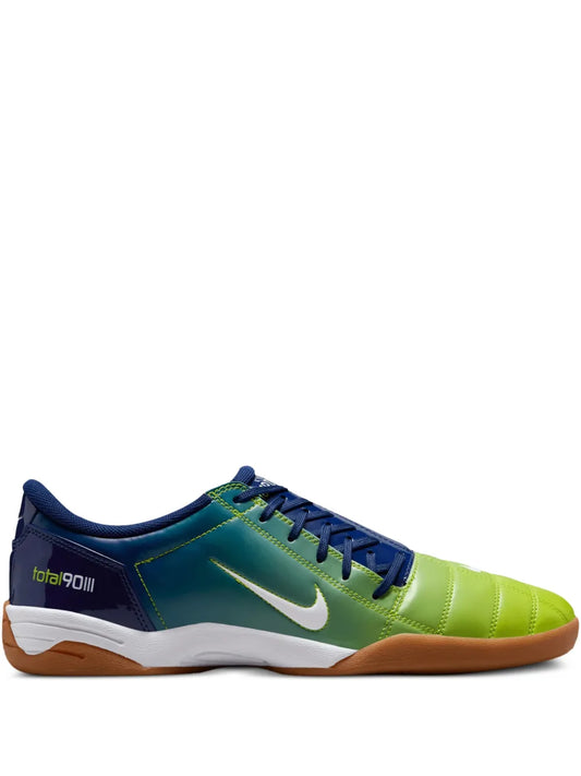 Nike low-top sneakers in dark blue and neon green with white Swoosh and gum sole