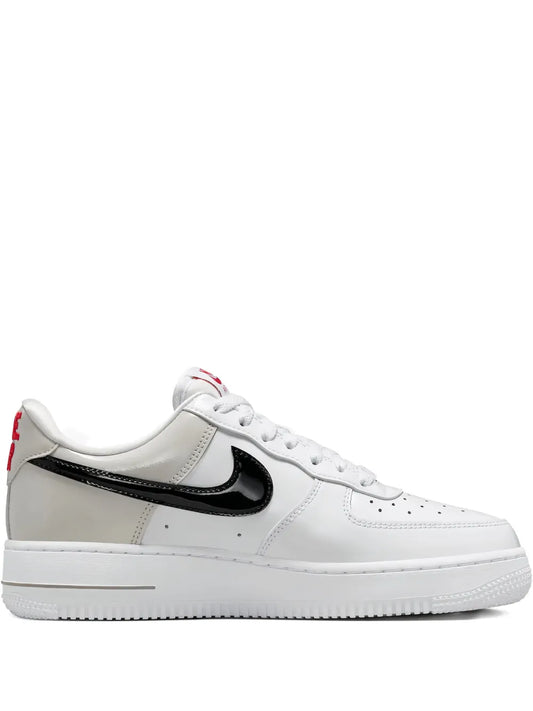 Nike Air Force 1 low-top sneakers, white leather with black swoosh and laces