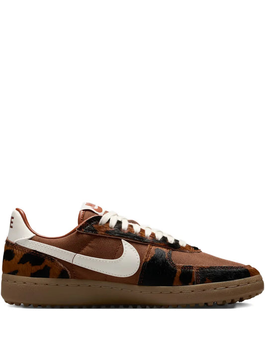 Nike low-top sneaker, dark brown cow-print with white Swoosh and gum sole