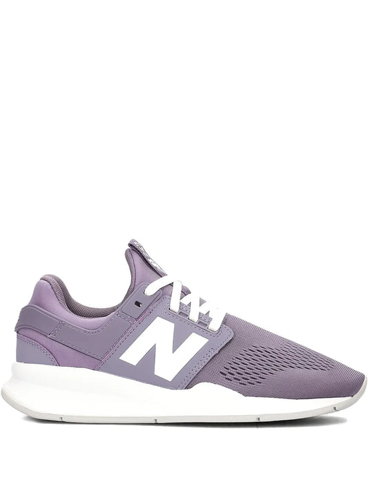 New Balance 247 purple lace-up sneakers with white N logo and cushioned sole